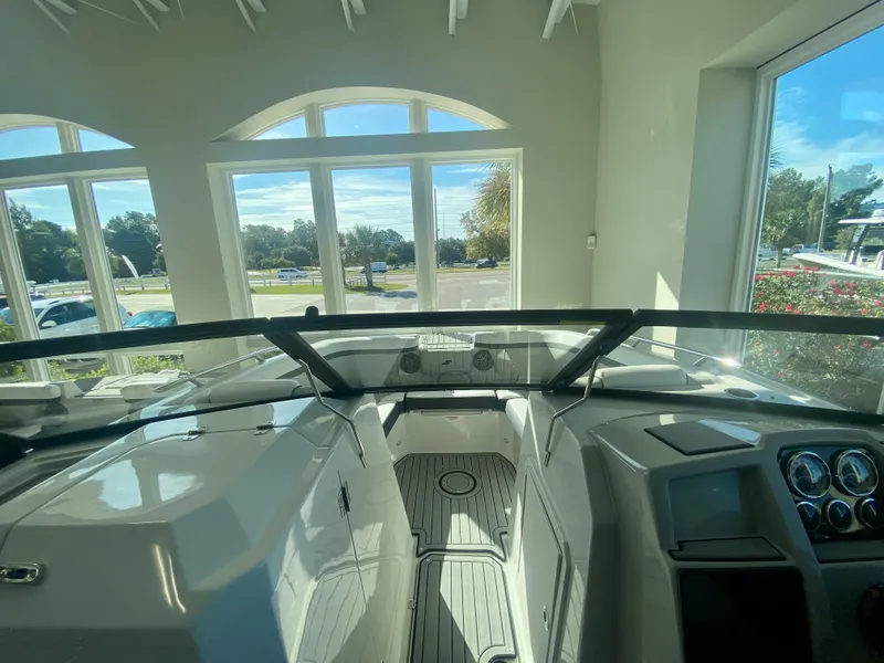 Slide: The Image of 2024 Starcraft SVX 230 OB boat interior with dashboard and windshield. - 22