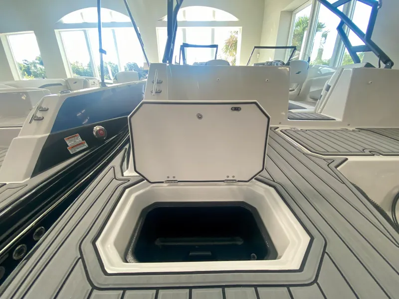 Slide: The Image of 2024 Starcraft SVX 230 OB boat with open storage compartment. - 4
