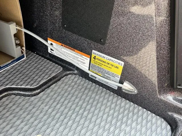 Slide: The Image of 2023 Caymas CX20 Pro bass boat interior with seating and storage compartments. - 10