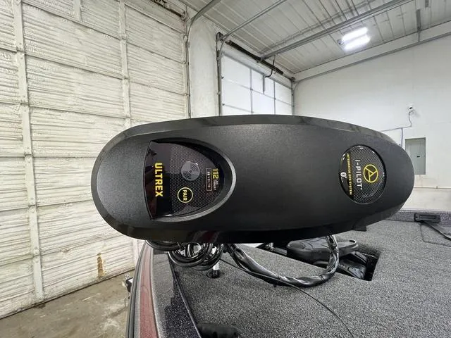 Slide: The Image of 2023 Caymas CX20 Pro with Ultrex trolling motor in a garage setting. - 14