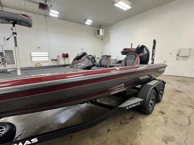 Slide: The Image of 2023 Caymas CX20 Pro bass boat in a garage, showcasing sleek design and modern features. - 15