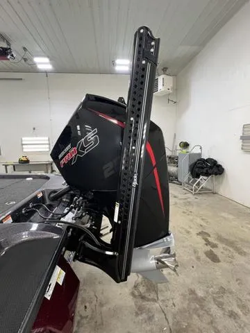 Slide: The Image of 2023 Caymas CX20 Pro boat engine in a garage setting. - 17