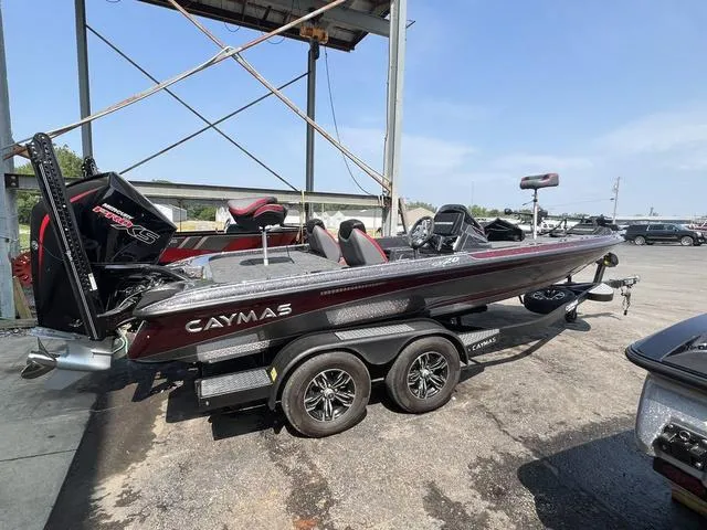Slide: The Image of 2023 Caymas CX20 Pro bass boat in a garage. - 2