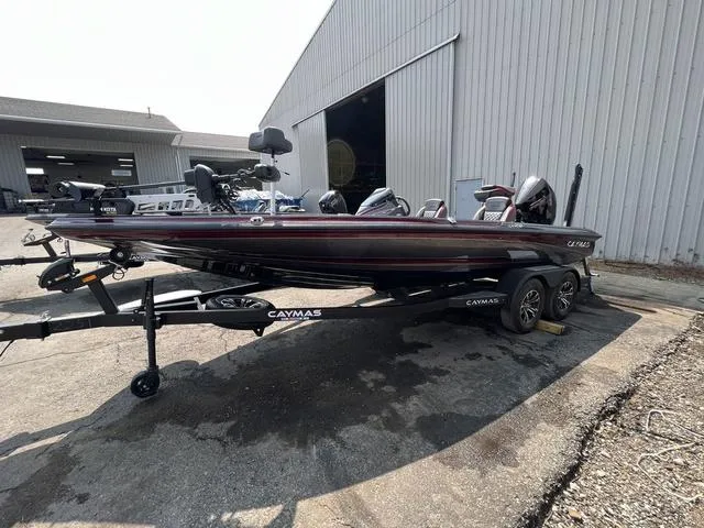 Slide: The Image of 2023 Caymas CX20 Pro boat engine in a garage. - 8