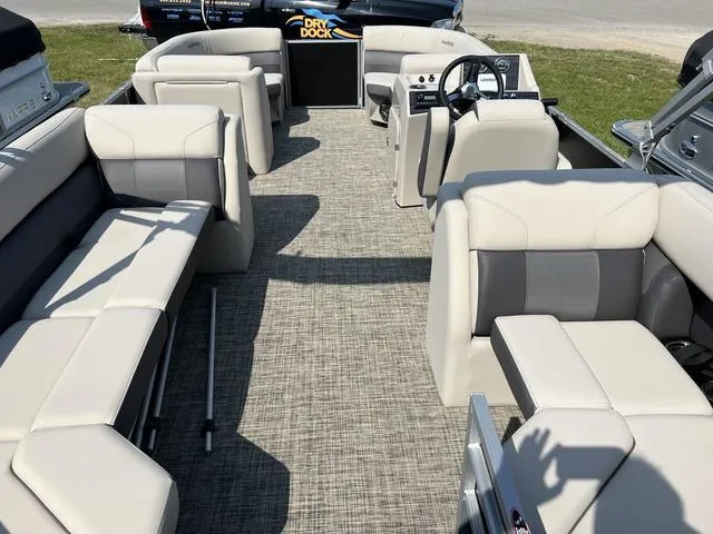 Slide: The Image of 2023 Harris Cruiser 210 CW pontoon boat interior with spacious seating and modern helm. - 16