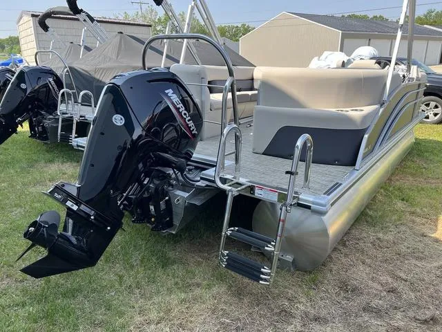 Slide: The Image of 2023 Harris Cruiser 210 CW pontoon boat with Mercury outboard motor. - 17