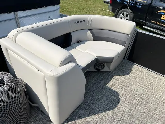 Slide: The Image of 2023 Harris Cruiser 210 CW boat interior seating with gray and white upholstery. - 6