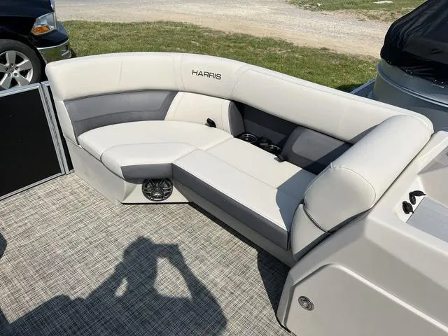 Slide: The Image of 2023 Harris Cruiser 210 CW boat interior with cushioned seating. - 7