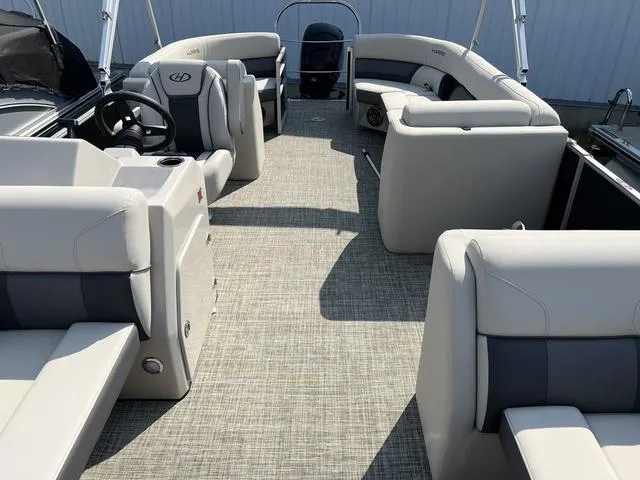 Slide: The Image of 2023 Harris Cruiser 210 CW pontoon boat interior with spacious seating and modern design. - 8