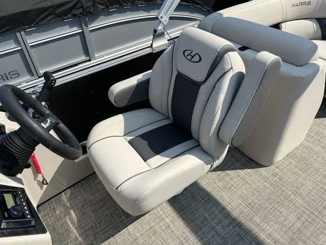 Slide: The Image of 2023 Harris Cruiser 210 CW boat captain's chair and steering console. - 9