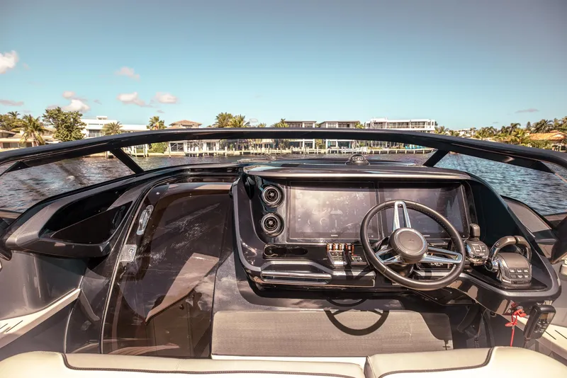Slide: The Image of Luxurious 2022 Princess R Class 35 yacht cockpit with modern steering and navigation controls. - 19