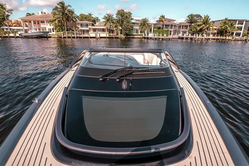 Slide: The Image of Luxury Princess R Class 35 yacht cruising on a scenic waterfront, 2022 model. - 22