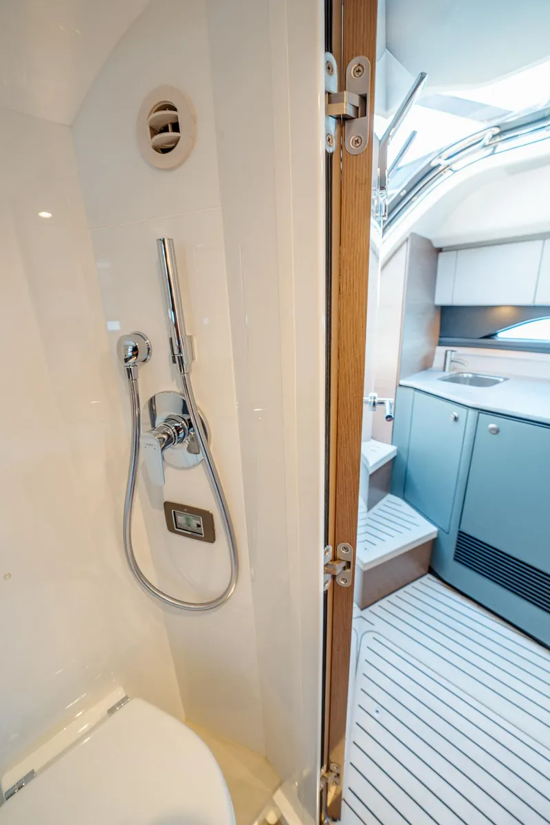 Slide: The Image of Interior of 2022 Princess R Class 35 yacht, featuring modern bathroom and sleek cabinetry. - 28