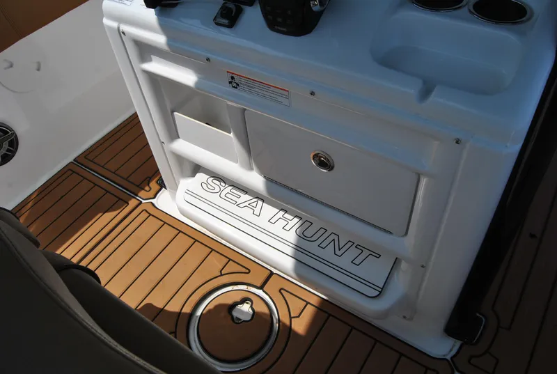 Slide: The Image of 2020 Sea Hunt Gamefish 30 boat interior with teak flooring and storage compartments. - 24