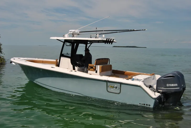 Slide: The Image of 2020 Sea Hunt Gamefish 30 boat on calm water with Yamaha engine. - 28