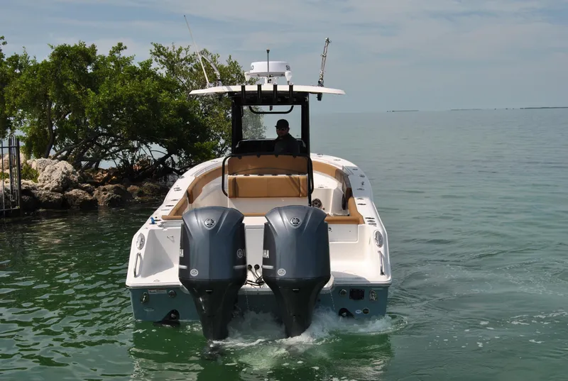 Slide: The Image of 2020 Sea Hunt Gamefish 30 boat with dual engines on calm water. - 29