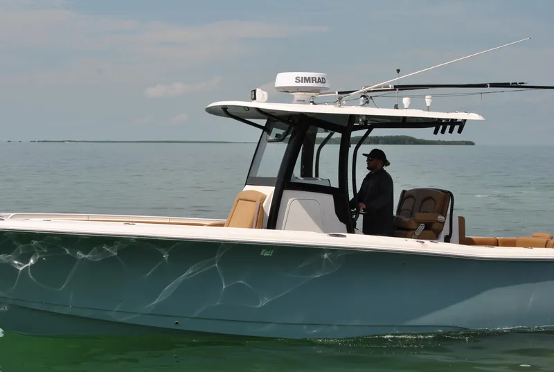 Slide: The Image of 2020 Sea Hunt Gamefish 30 boat on calm water, featuring a sleek design and modern equipment. - 34