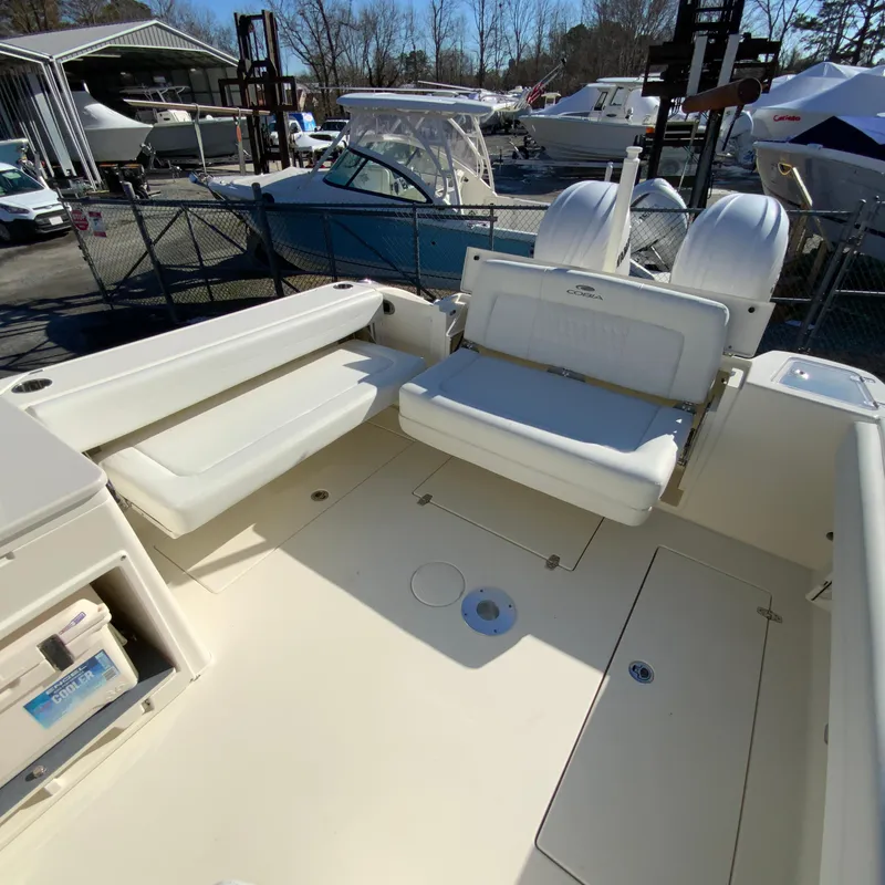 Slide: The Image of 2025 Cobia 280 Dual Console boat interior with seating and storage. - 16