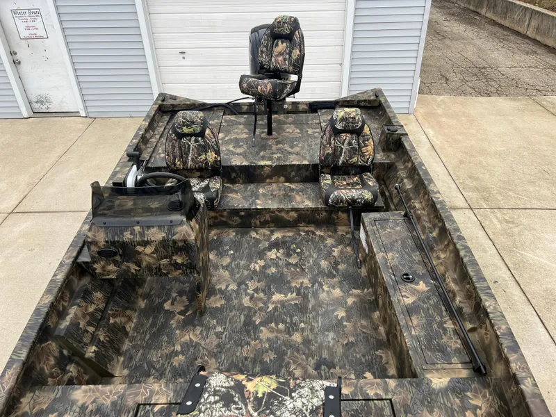 Slide: The Image of 2024 Lund 1870 Predator SC boat with camo interior and seating. - 13