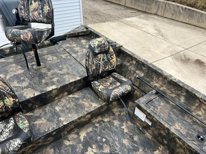 Slide: The Image of 2024 Lund 1870 Predator SC boat with camouflage seating and deck. - 16