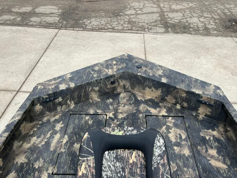 Slide: The Image of 2024 Lund 1870 Predator SC boat with camouflage interior design. - 9