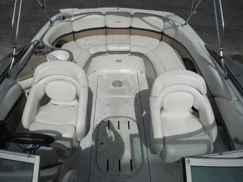Slide: The Image of 2006 Four Winns 255 Sundowner boat interior with white seating and spacious layout. - 19