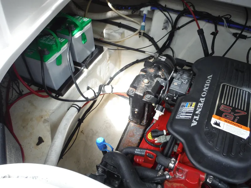 Slide: The Image of Engine compartment of a 2006 Four Winns 255 Sundowner with Volvo Penta engine and dual batteries. - 22