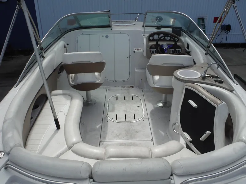 Slide: The Image of 2006 Four Winns 255 Sundowner boat interior with seating and steering console. - 28