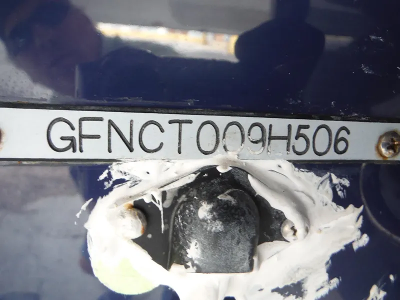 Slide: The Image of Hull identification number (HIN) on a 2006 Four Winns 255 Sundowner boat. - 29