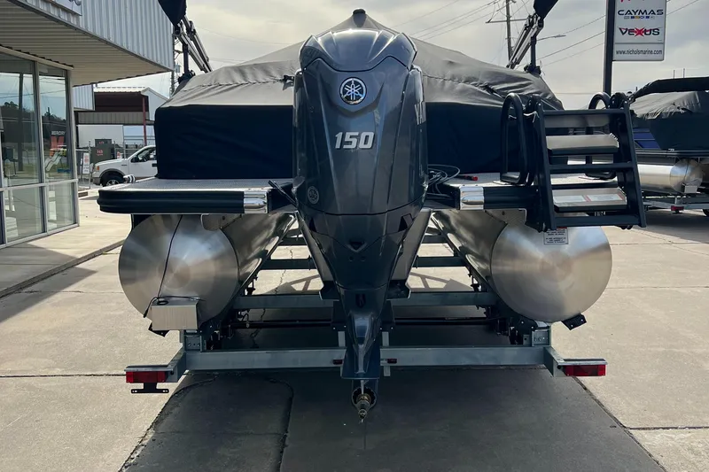 Slide: The Image of 2024 Bennington 22 SXSR pontoon boat with 150 HP engine on trailer. - 13