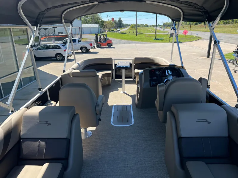 Slide: The Image of 2024 Bennington 22 SXSR pontoon boat interior with seating and helm. - 3