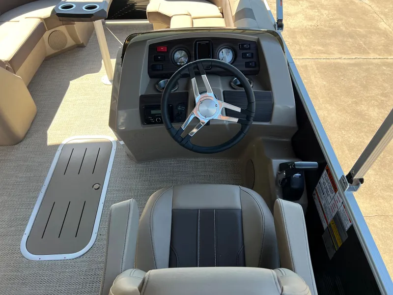 Slide: The Image of 2024 Bennington 22 SXSR boat interior with steering wheel and seating. - 4