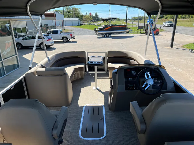 Slide: The Image of 2024 Bennington 22 SXSR pontoon boat interior with seating and steering console. - 5