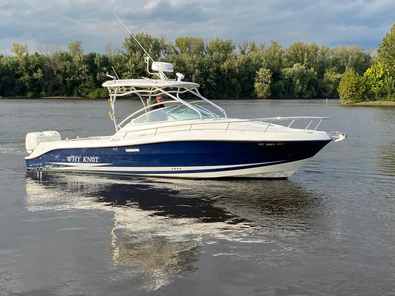 Slide: The Image of 2007 Hydra-Sports 2900VX boat on calm water with trees in the background. - 0