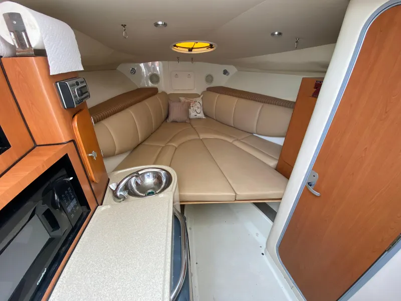 Slide: The Image of 2007 Hydra-Sports 2900VX cabin interior with kitchenette and seating area. - 17