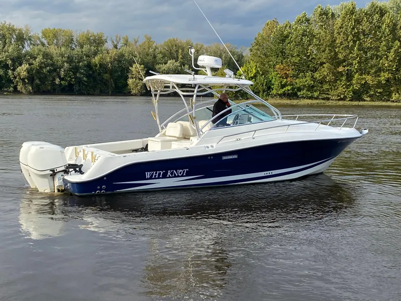 Slide: The Image of 2007 Hydra-Sports 2900VX boat on calm water with trees in the background. - 2