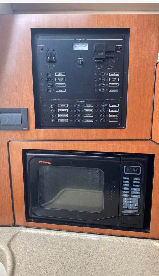 Slide: The Image of Control panel and microwave in 2007 Hydra-Sports 2900VX boat interior. - 20