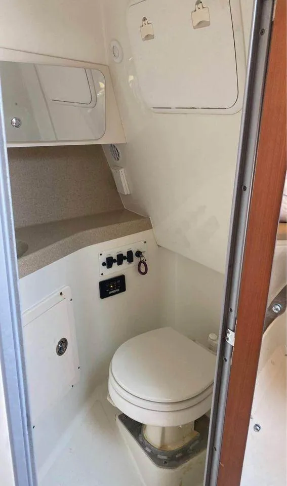Slide: The Image of 2007 Hydra-Sports 2900VX boat bathroom with toilet and storage compartments. - 22