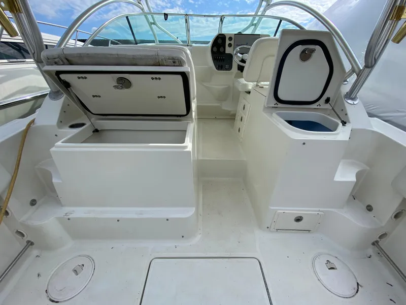 Slide: The Image of 2007 Hydra-Sports 2900VX boat interior with open storage compartments. - 8