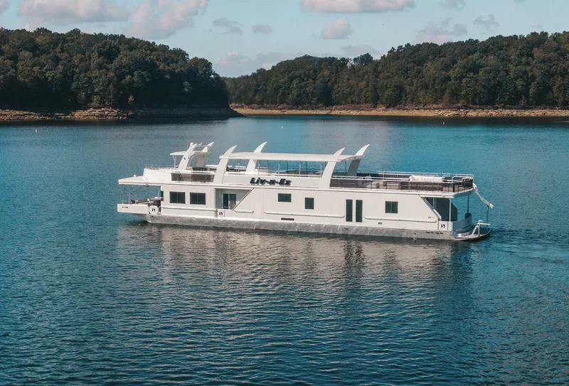 Slide: The Image of 2007 Sharpe 20 x 100 houseboat cruising on a serene lake. - 0