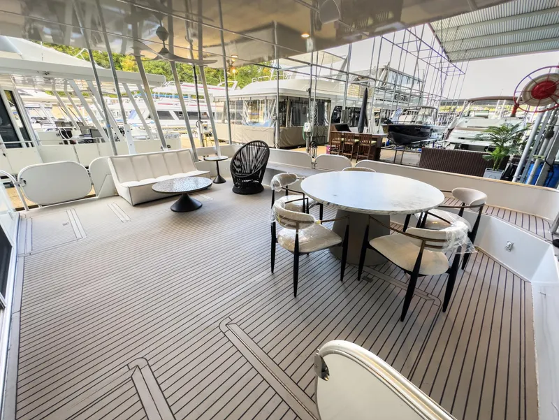 Slide: The Image of Spacious deck of a 2007 Sharpe 20 x 100 houseboat with modern outdoor furniture. - 15
