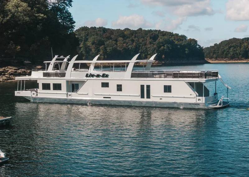 Slide: The Image of Houseboat on a lake, Sharpe 20 x 100 model, 2007, surrounded by trees. - 2