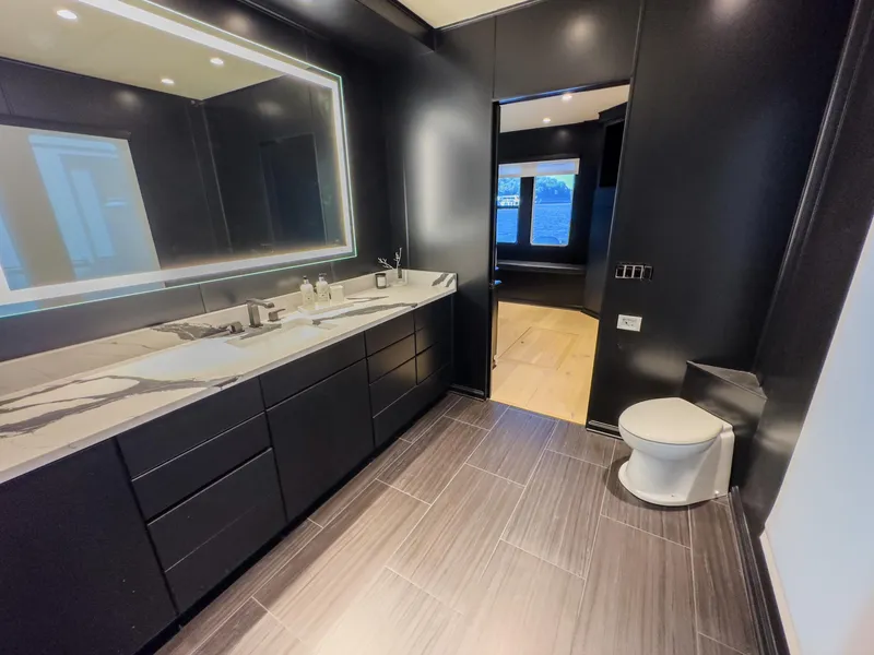 Slide: The Image of Modern bathroom with black cabinetry, large mirror, and sleek fixtures, Sharpe 20 x 100, 2007. - 20