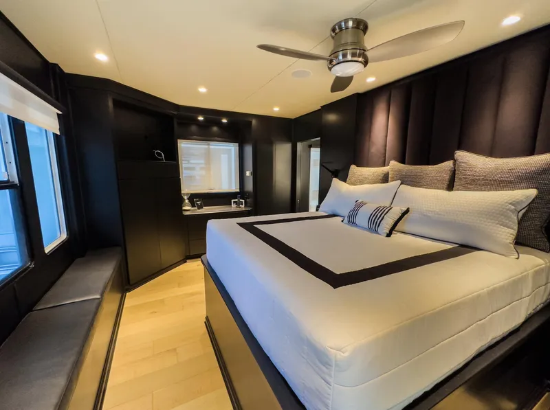 Slide: The Image of Luxurious bedroom in a 2007 Sharpe 20 x 100 houseboat with modern decor and large bed. - 29