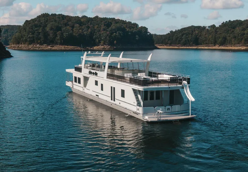 Slide: The Image of Luxury houseboat Sharpe 20 x 100, 2007 model, cruising on a serene lake. - 5