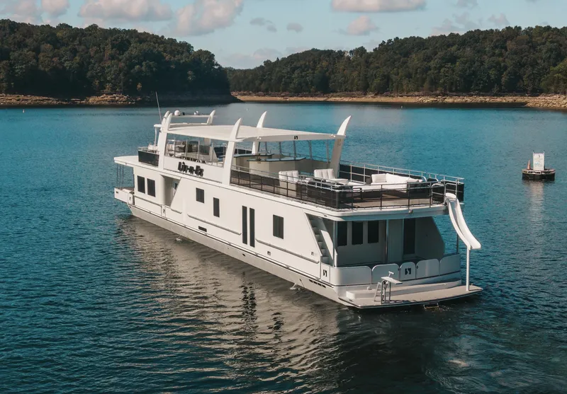 Slide: The Image of Luxury Sharpe 20 x 100 houseboat, 2007 model, cruising on a serene lake. - 6