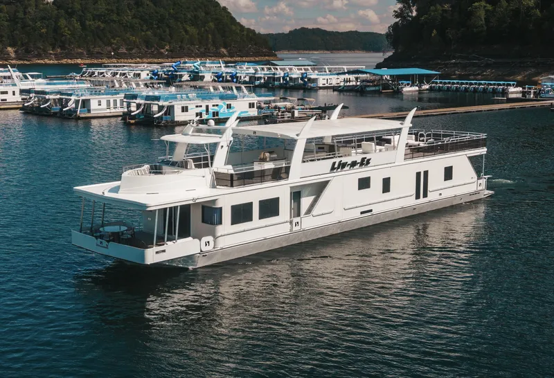 Slide: The Image of Luxury 2007 Sharpe 20 x 100 houseboat docked in a scenic marina. - 7