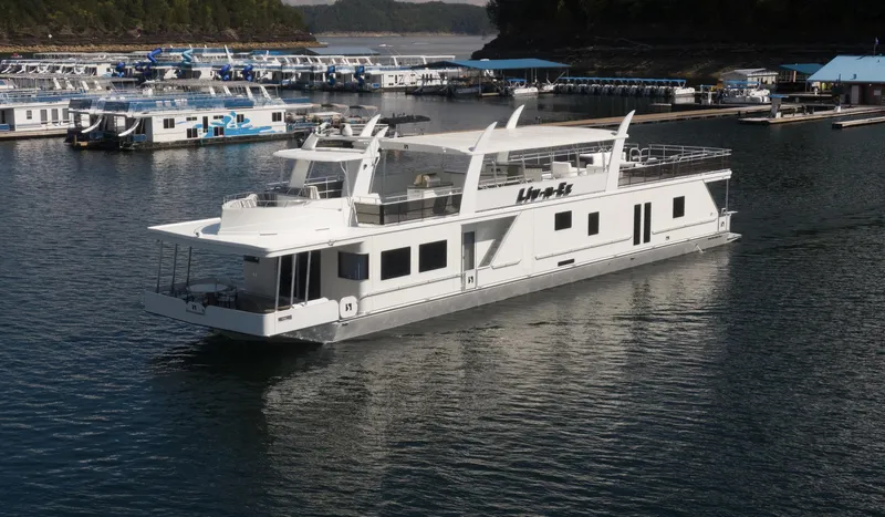 Slide: The Image of Luxury houseboat Sharpe 20 x 100, 2007 model, cruising in a marina. - 8