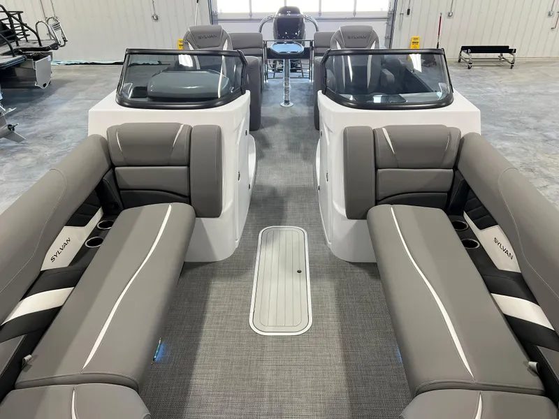 Slide: The Image of The image shows the interior of a 2024 Sylvan S-5 LZ DC boat with gray seating. - 13