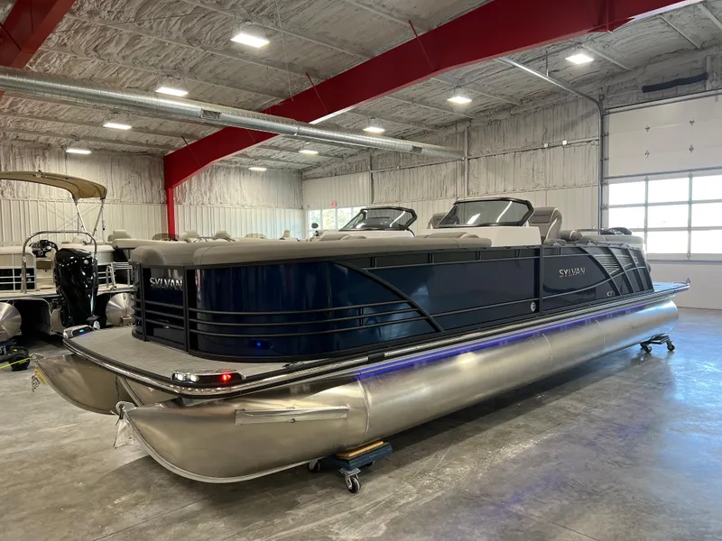The Image of A luxurious Sylvan pontoon boat, model S-5 LZ DC, year 2024, is in a showroom. - 1